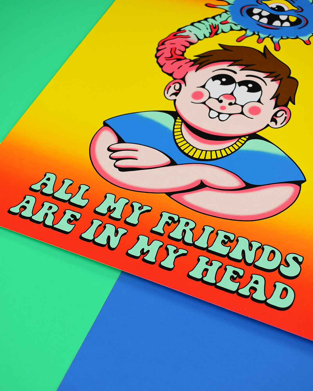 Poster that reads All My Friends Are in My Head. It has a brown haired kid with rosy chubby cheeks and 2 large front teeth, wearing a blue t-shirt and the kids arms are crossed. From the left side of his head a monster is coming out and over the kids head. The monster is blue with one eye and open mouth with eight teeth and antennas all around its face.