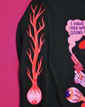 Load image into Gallery viewer, Black background with a bust of a skull in a red cloak and cowboy hat. The skull has 4 sweat drops on it's forehead and 2 gold teeth and is holding a red smoking gun in it's right hand. There is a large eye ball with veins connected to it at the bottom. The top reads I Have No Idea What's Going On and Have No Interest in Ever Finding Out.