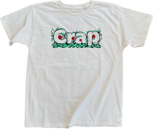 A cream colored short sleeve tee with the word "Crap" printed on the chest area that is camouflaged in green leaves and red flowers.