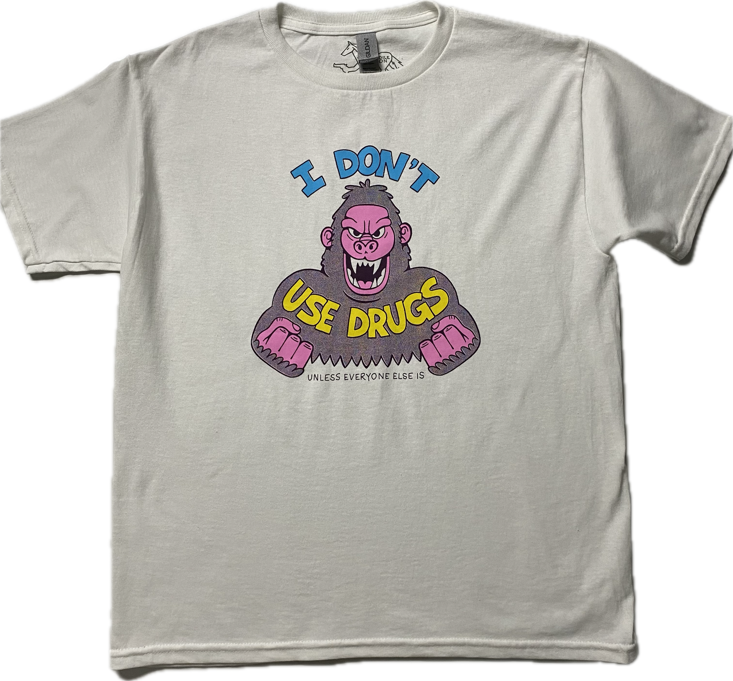 A white short sleeve t-shirt with an angry purple cartoon gorilla with clinched fists and fangs.. It reads I Don't in blue font then Use Drugs in gold font. In tiny font at the bottom it reads Unless Everyone Else Is.