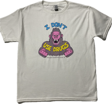 Charger l&#39;image dans la galerie, A white short sleeve t-shirt with an angry purple cartoon gorilla with clinched fists and fangs.. It reads I Don&#39;t in blue font then Use Drugs in gold font. In tiny font at the bottom it reads Unless Everyone Else Is.
