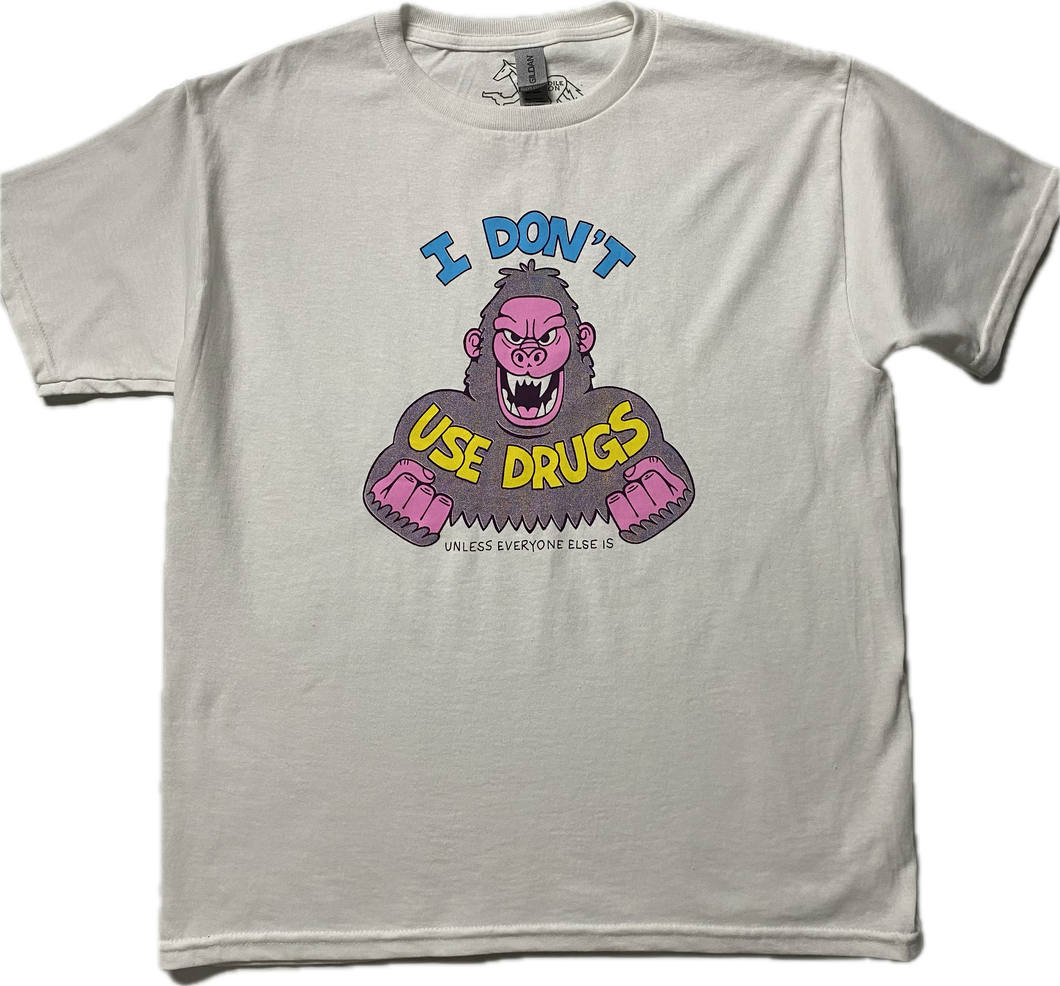 A white short sleeve t-shirt with an angry purple cartoon gorilla with clinched fists and fangs.. It reads I Don't in blue font then Use Drugs in gold font. In tiny font at the bottom it reads Unless Everyone Else Is.