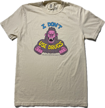 Load image into Gallery viewer, An off white short sleeve t-shirt with an angry purple cartoon gorilla with clinched fists and fangs..  It reads I Don&#39;t in blue font then Use Drugs in gold font.  In tiny font at the bottom it reads Unless Everyone Else Is.
