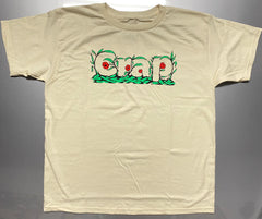 A cream colored short sleeve tee with the word "Crap" printed on the chest area that is camouflaged in green leaves and red flowers.  Silver metallic background .