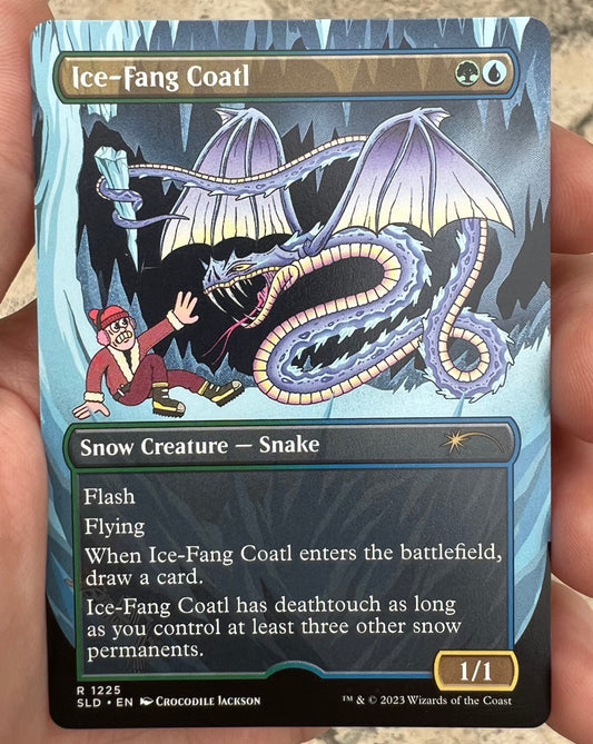 A trading card from Hasbro's Magic the Gathering.  This card is called Ice-Fang Coatl and the creature is a called a Snow Creature - Snake.  It is a purple snake like dragon holding a large icicle over a cartoon man in a red outfit that is trying to stay alive.  Below the image is a list of the powers of the creature.