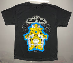 A black short sleeve tee that reads Feel something at the top with silver color and lighting around it.  Below the words is a cartoon skull robot in gold that is strapped in an electric chair.  Between it's feet is a gold mouse coming out of the bottom of the chair.  Crocodile Jackson signature at the bottom.