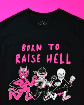 A black short sleeve t-shirt with Born to Raise Hell printed in a pink puffy font. There are 3 characters in a mid run pose below the wording. The first character is a pink devil with a black cape and thong. The 2nd character is a thief w/a black polka dot bandana, black eye mask, black/white striped long sleeve shirt, black pants and high top black sneakers. The 3rd character is a skeleton with a black robe, white socks and pink/white checkered sneakers.