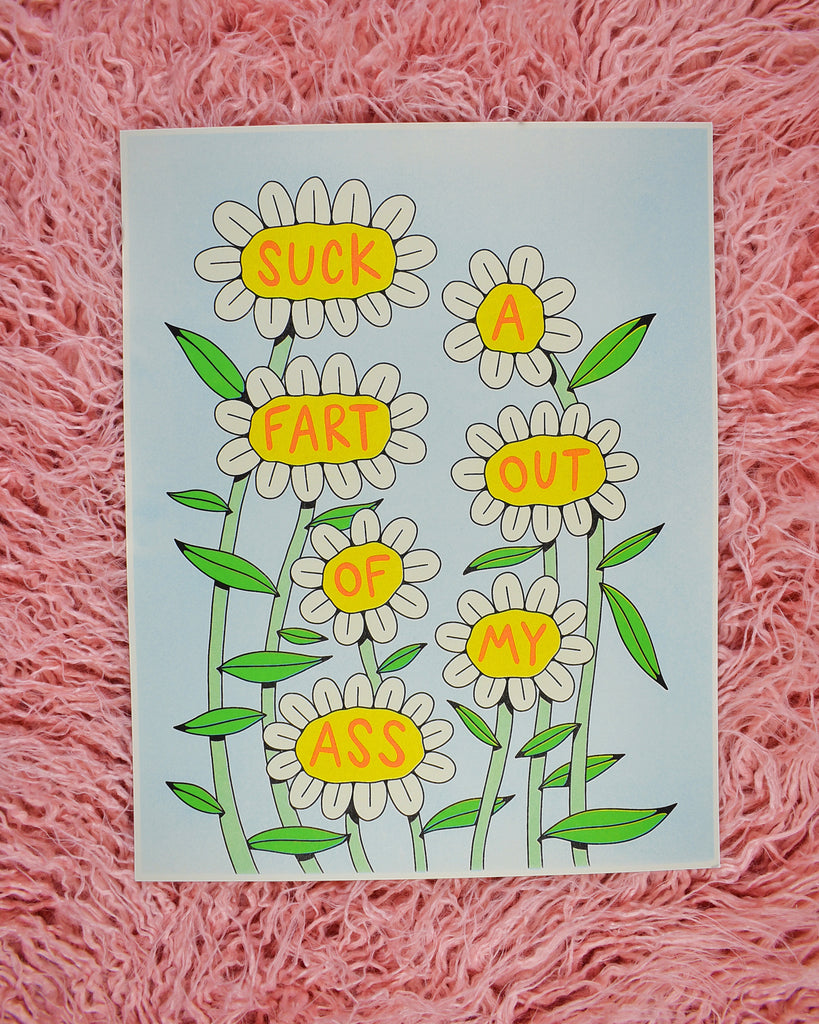 A print with 7 white daisies on tall green stems. Each flower has a word in the yellow center in red font that reads Suck a Fart Out of My Ass. The background it a light mint green.