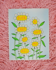 A print with 7 white daisies on tall green stems. Each flower has a word in the yellow center in red font that reads Suck a Fart Out of My Ass. The background it a light mint green.