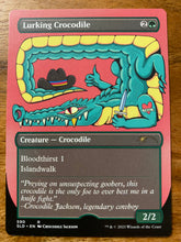 Load image into Gallery viewer, A trading card with a title of Lurking Crocodile.  Below the title is a cartoon crocodile with his tail overhead and a cowboy hat sitting on the end of it's tail.  The left arm of the crocodile is holding a knife and has a heart tattoo that reads 'Croc' on the top of it's arm.  Below the art is information on Hasbro's Magic the Gathering game.
