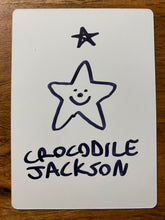 Load image into Gallery viewer, The back of the trading card that is all white and it has a hand drawn star with a smiley face and the artist signature in black marker.
