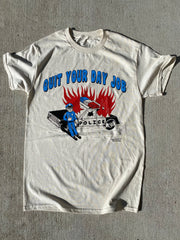 Cartoon flaming cop car on natural short-sleeve t-shirt that reads Quit Your Day Job in blue bubble font.  Artist signature at the bottom right that reads Crocodile Jackson.